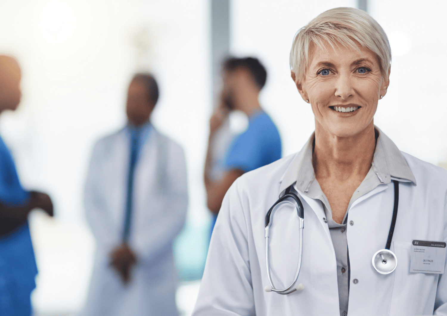 Primary care doctor coordinating patient specialty care referrals at Optima Medical in Arizona.