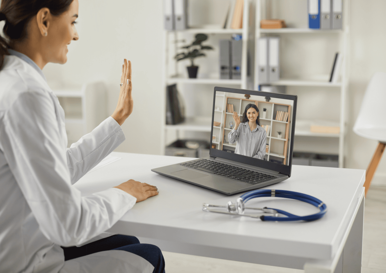 Doctor conducting a remote patient monitoring session via video call at Optima Medical, helping patients stay connected to healthcare from home.